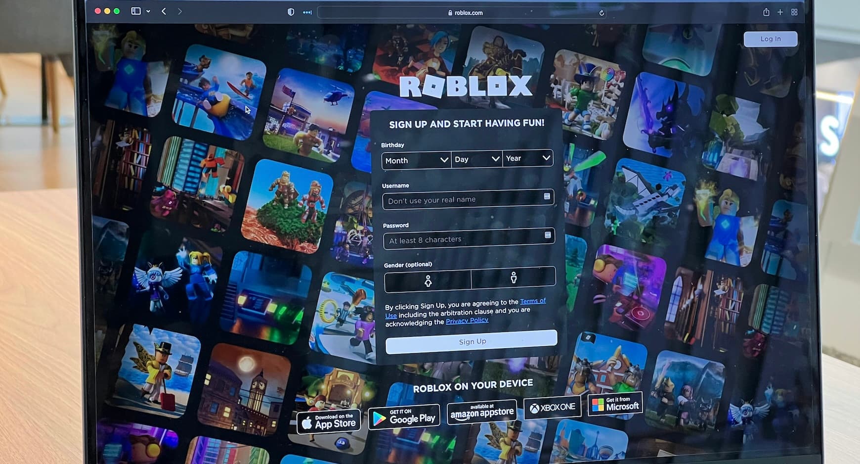 Child at a tablet while a parent adjusts Roblox safety settings together